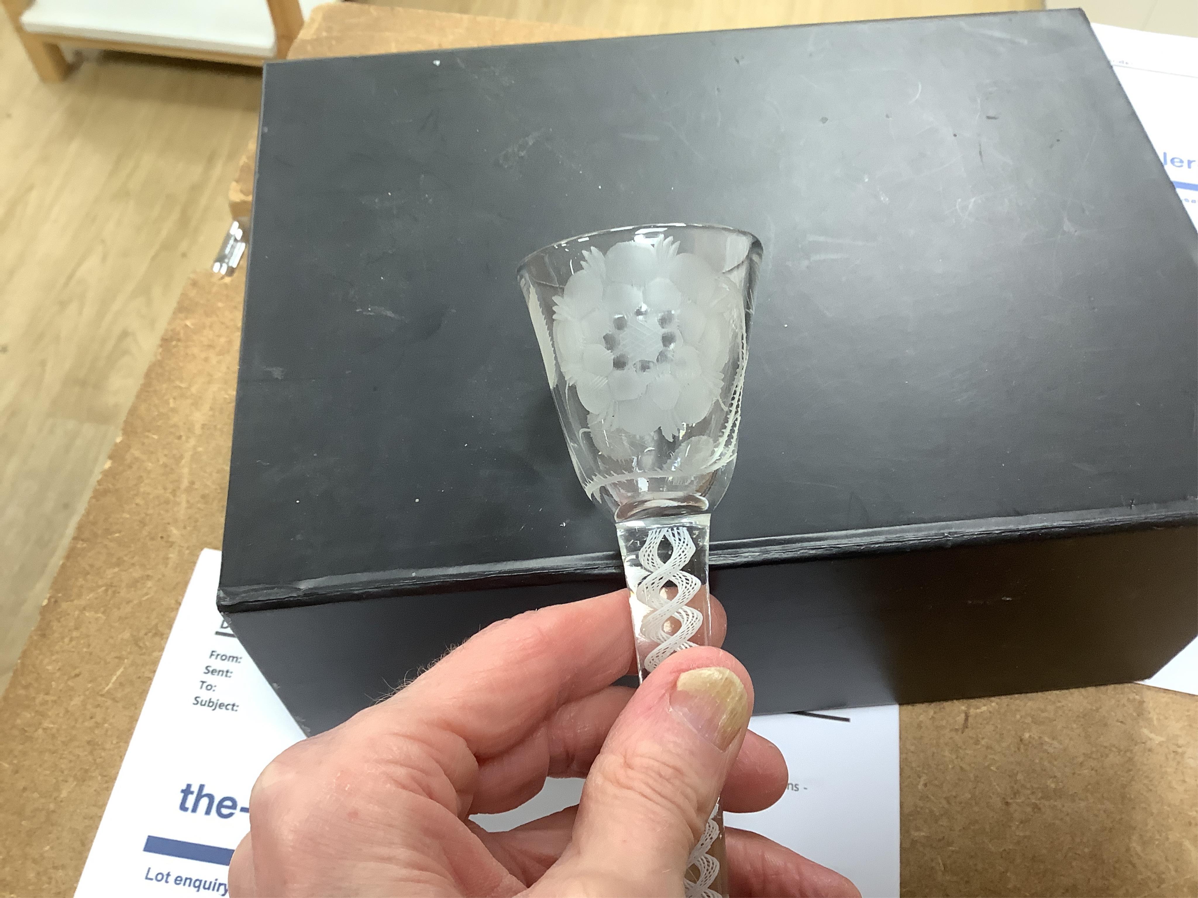 Two 18th century DSOT cordial glasses, one bowl engraved with roses, the other with swag decoration, tallest 16.5cm